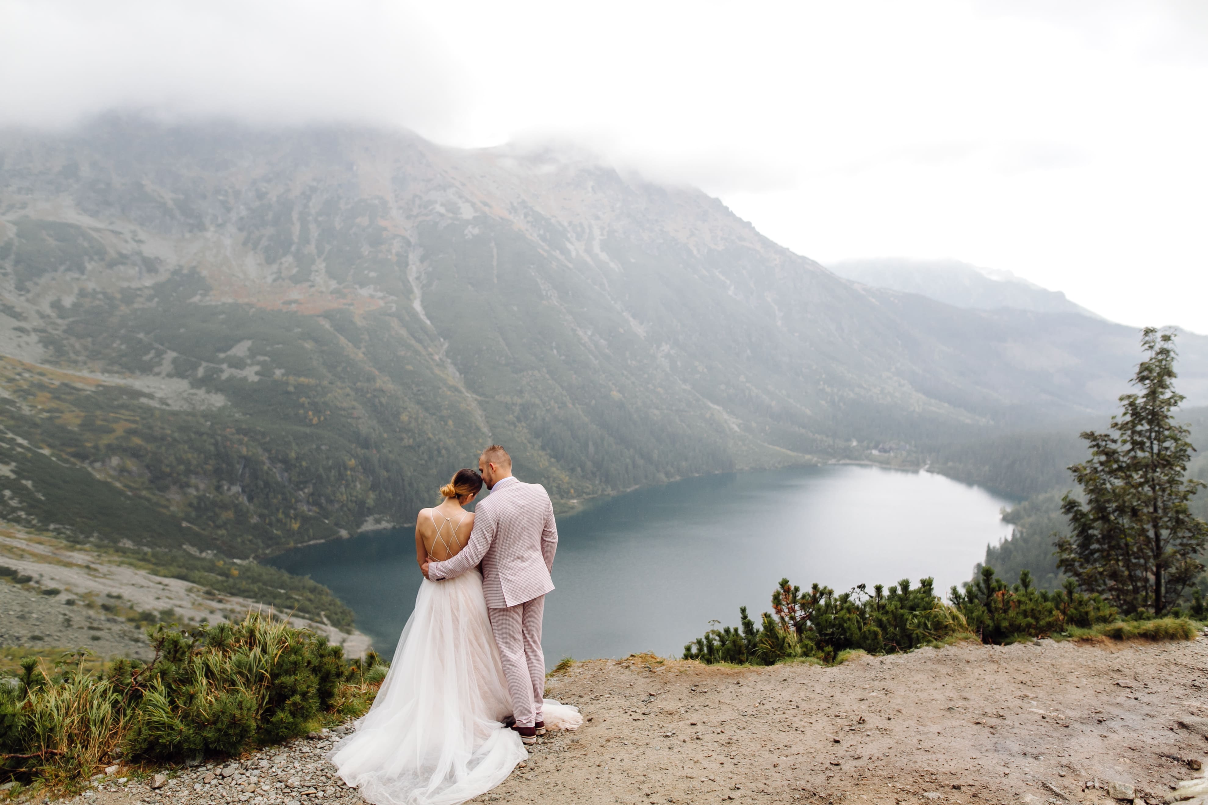 romantic-wedding-couple-love-standing-sea-eye-lake-poland-tatra-mountains